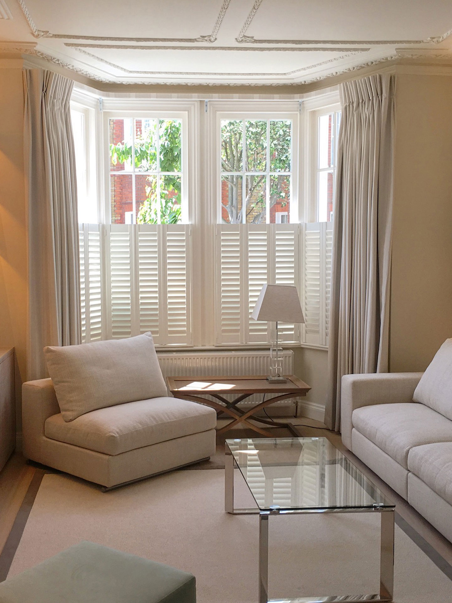 https://www.londonshades.co.uk/wp-content/uploads/2020/04/1-pinch-pleat-curtains-and-half-shutters.jpg